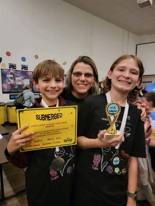 Brick Rays – Mercer Estes, teacher Jodi Diaz, and Jasper Szramowski